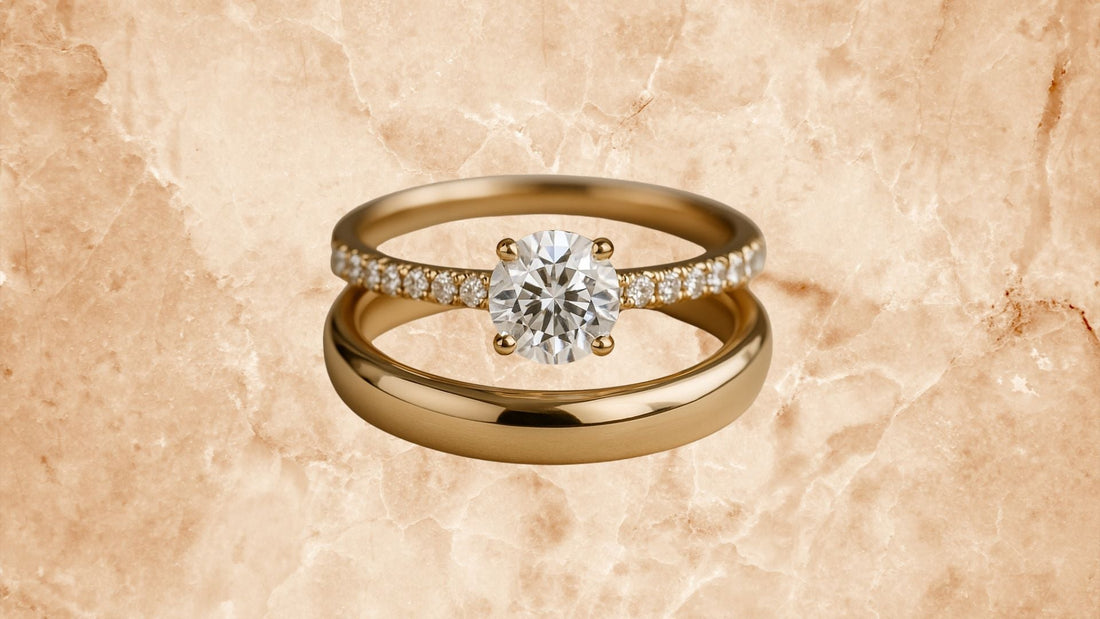 Close-up of two diamond rings on a pale stone surface, comparing engagement and wedding ring styles