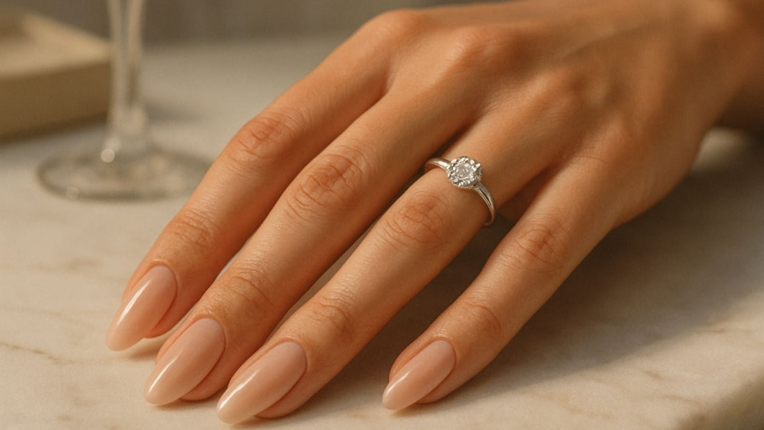 Close-up of a slender silver promise ring worn on a woman's hand