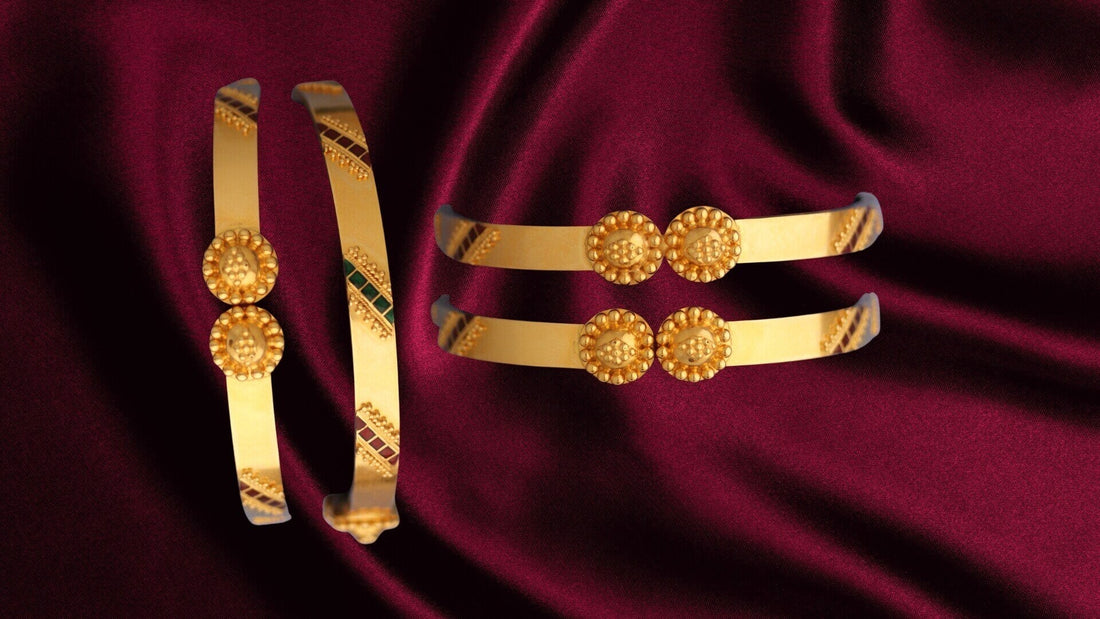 Gold jewellery decorated with fine raised granulation beads against rich red fabric