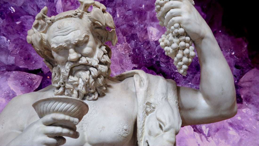 Purple amethyst crystals among carved classical Greek figures in a mythological scene