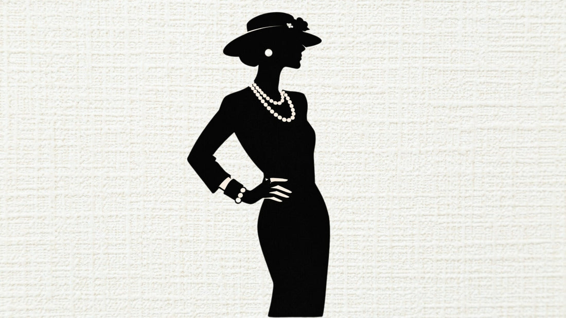 Fashion illustration of a woman in a black dress, wide-brimmed hat and pearl necklace inspired by Coco Chanel