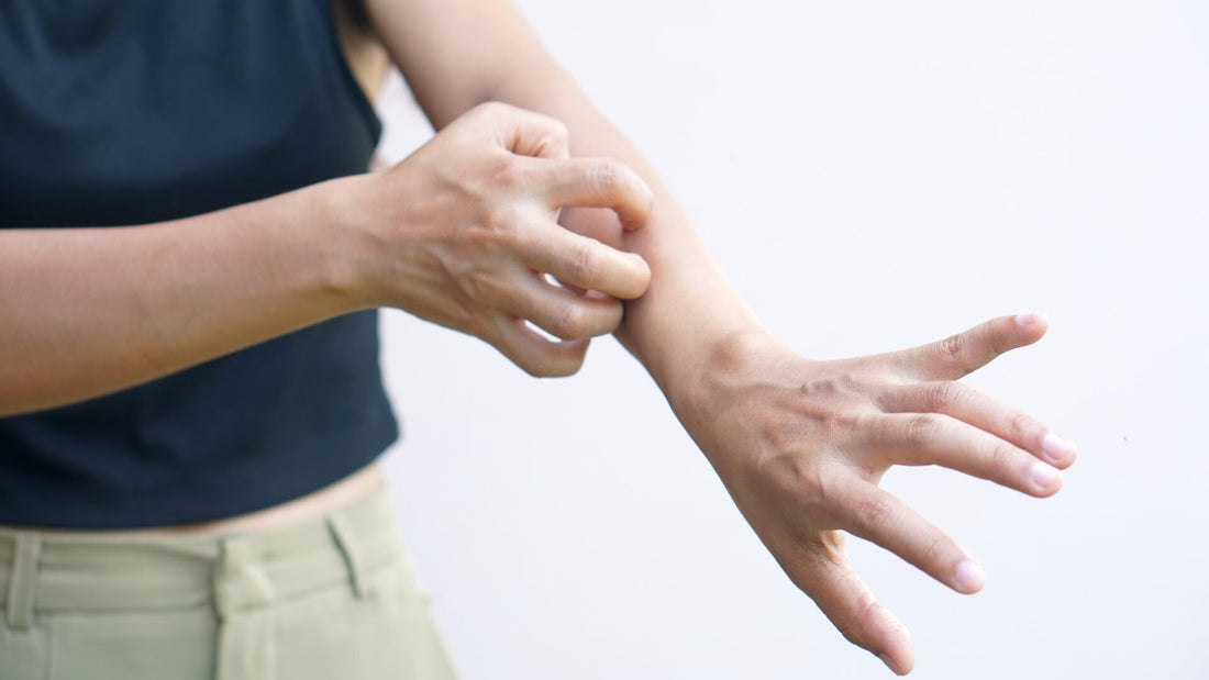 Close-up of a hand sliding on a ring, illustrating hypoallergenic jewellery for sensitive skin