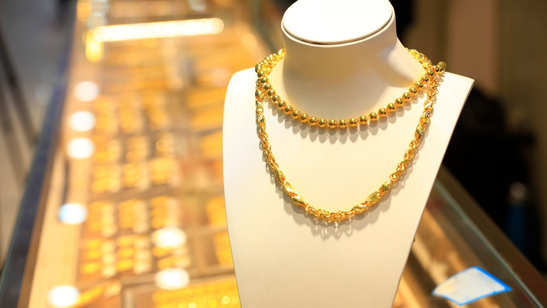 Gold jewellery chains and necklaces displayed on a stand to compare gold finishes