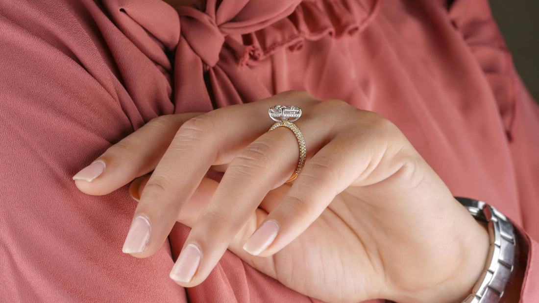 Sparkling solitaire engagement ring with a small hidden halo beneath the centre diamond