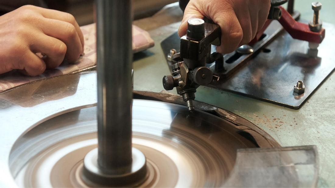 Precision cutting equipment shaping a gemstone in a jewellery workshop