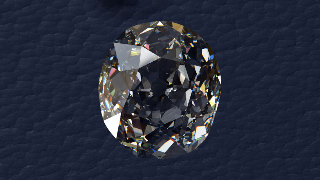 The Kohinoor diamond shown as a large brilliant-cut colourless gemstone against dark fabric