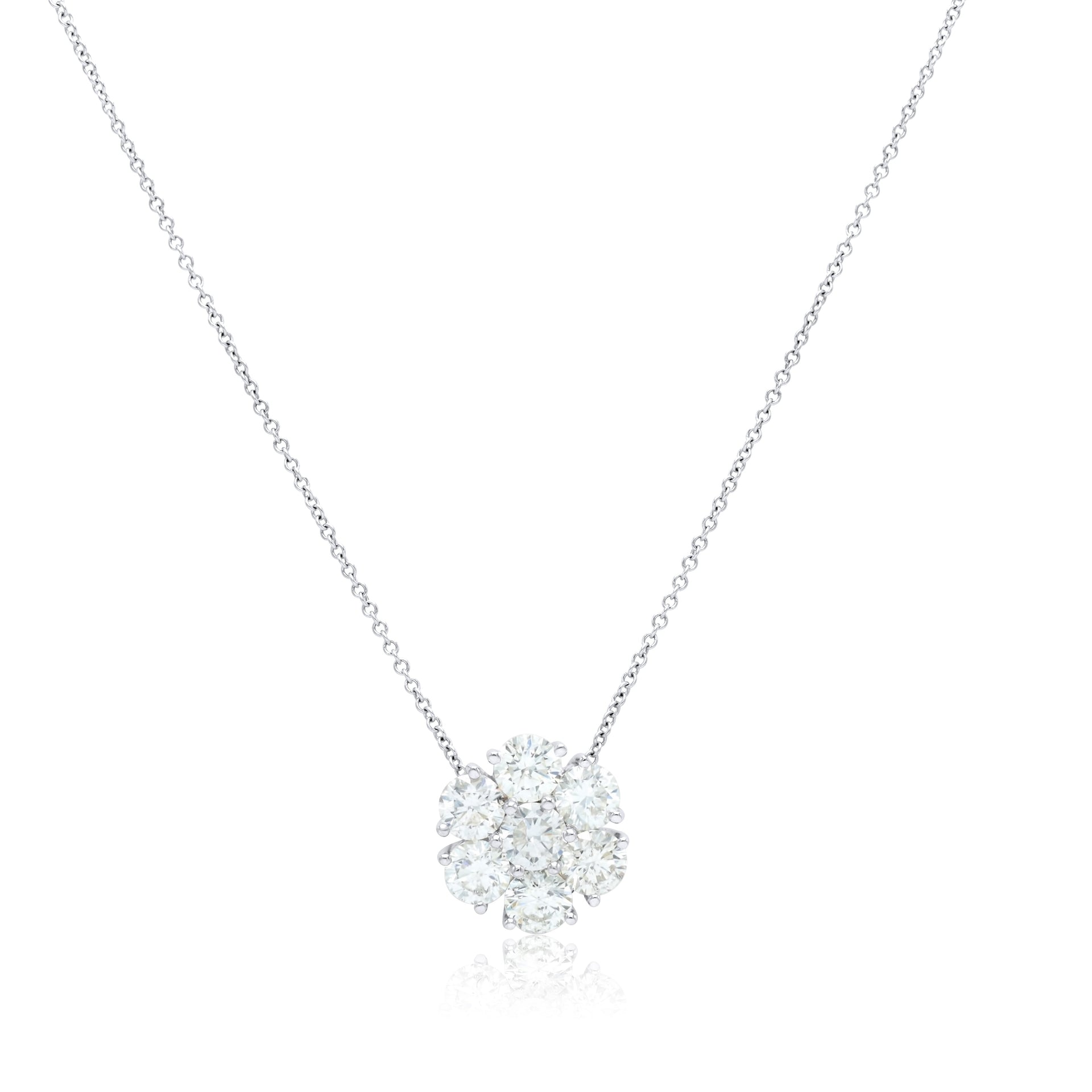 18 karat white gold cluster pendant with round brilliant cut diamonds weighing 0.56 cts total.