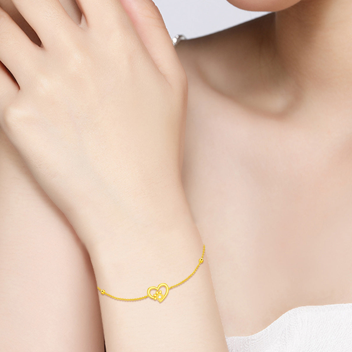 14K Gold Paw With Circular Cubic Zirconia Heart Charm Bracelet