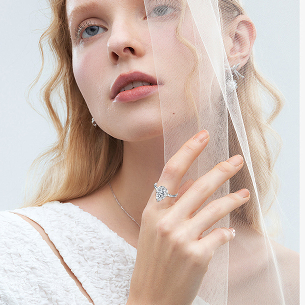 14K White Gold Pear Shaped Moissanite Wedding Ring