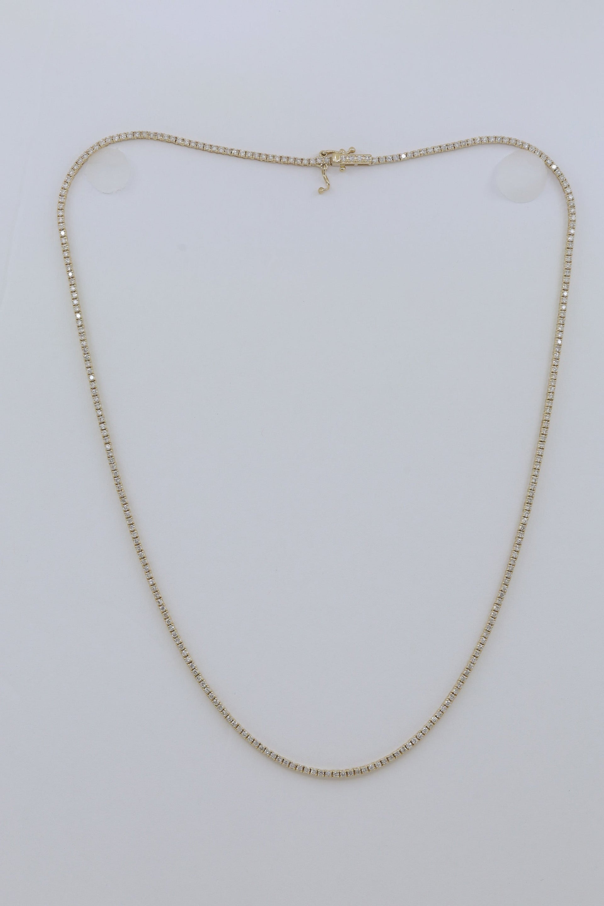 14kt yellow gold, 16' 4 prong diamond tennis necklace featuring 2.25 cts tw round diamonds