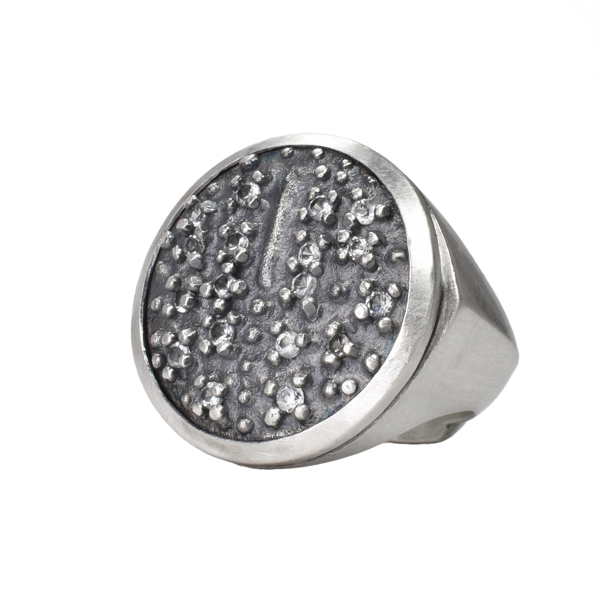 the Ethiopian shield ring with white sapphires