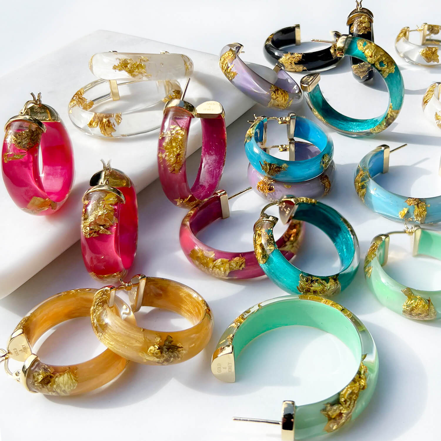 Gold Leaf Hoop Earrings In Clear