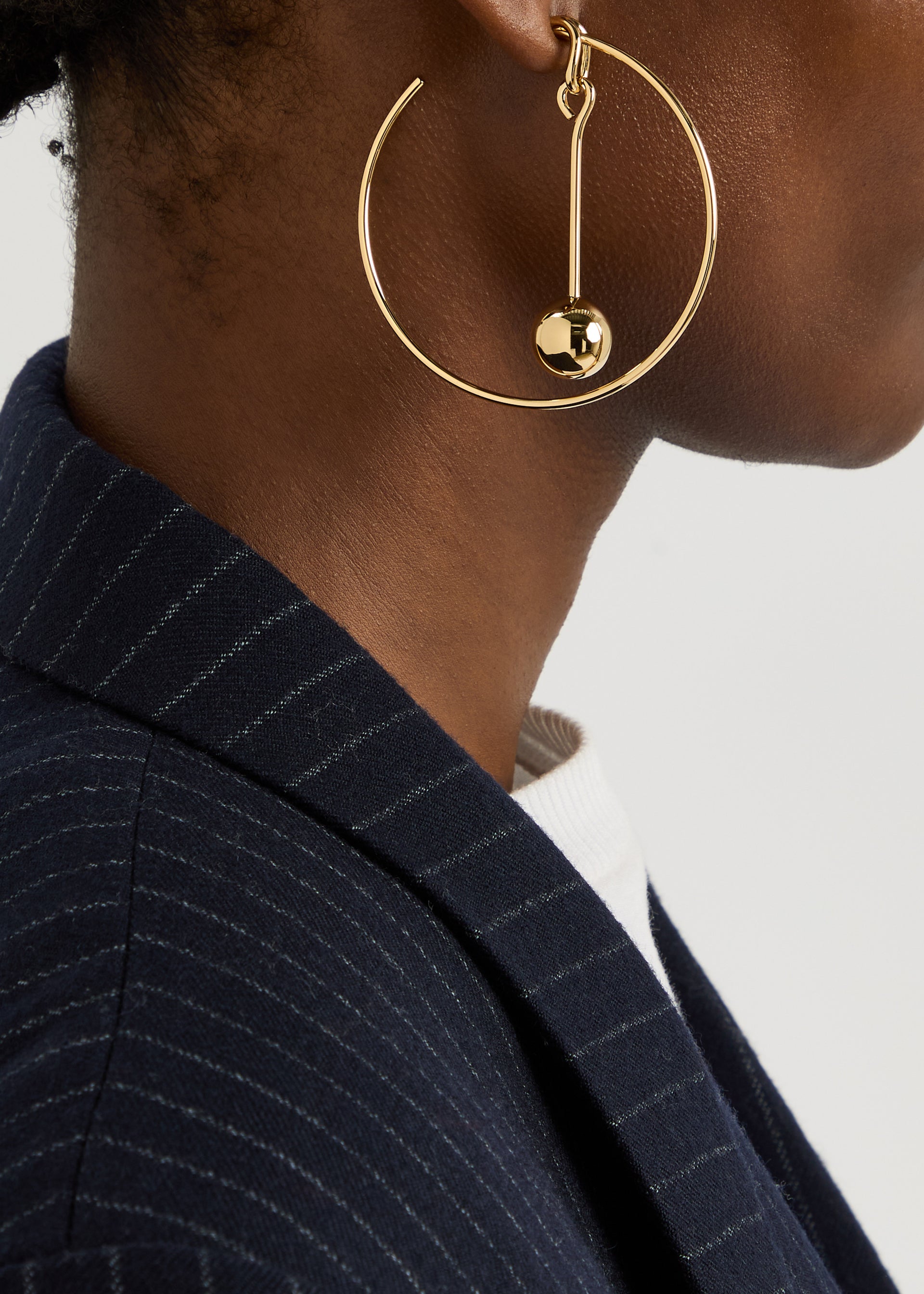 The Nodo asymmetric hoop earrings