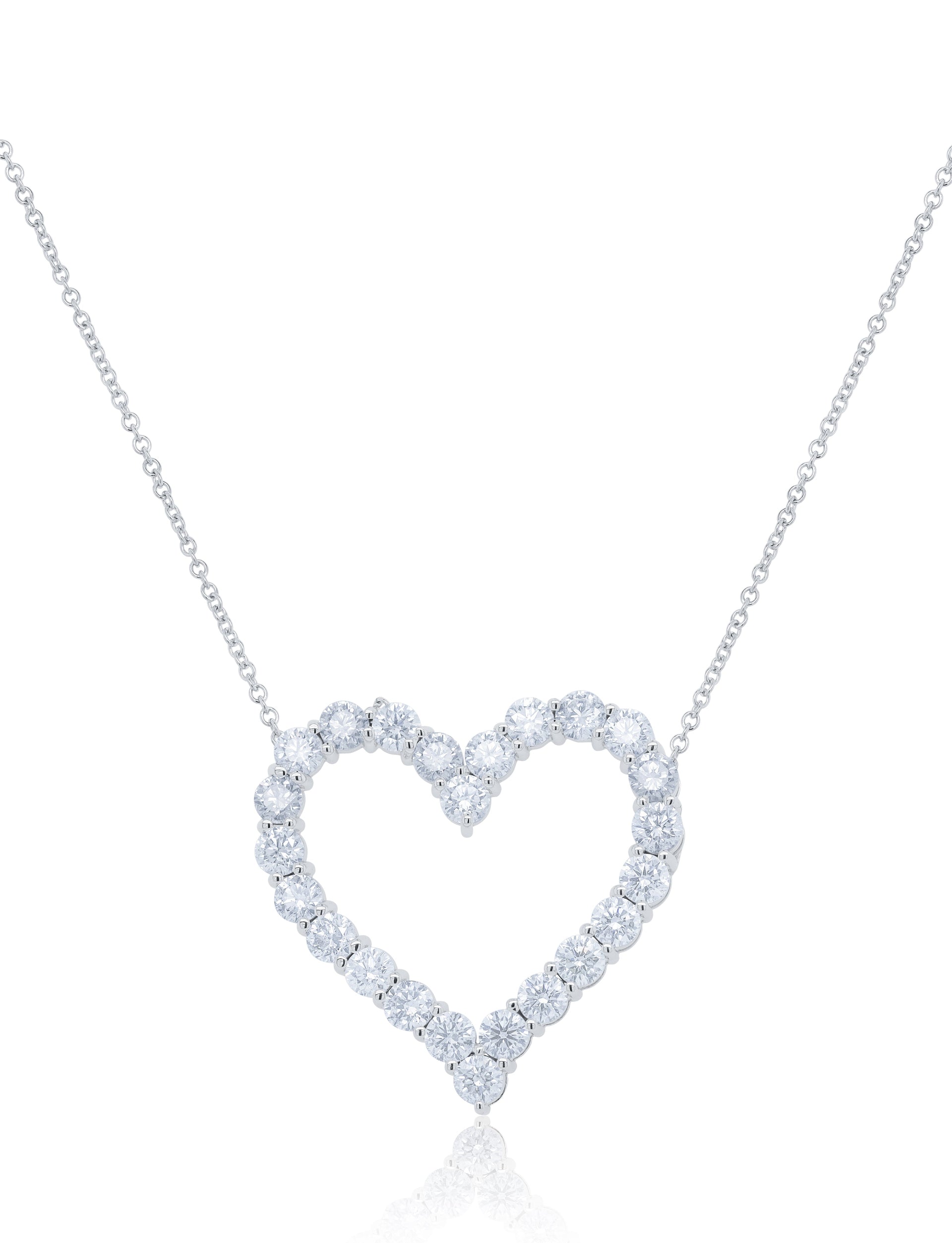 18kt white gold open heart pendant featuring 3.30 cts of round diamonds, 24 stones