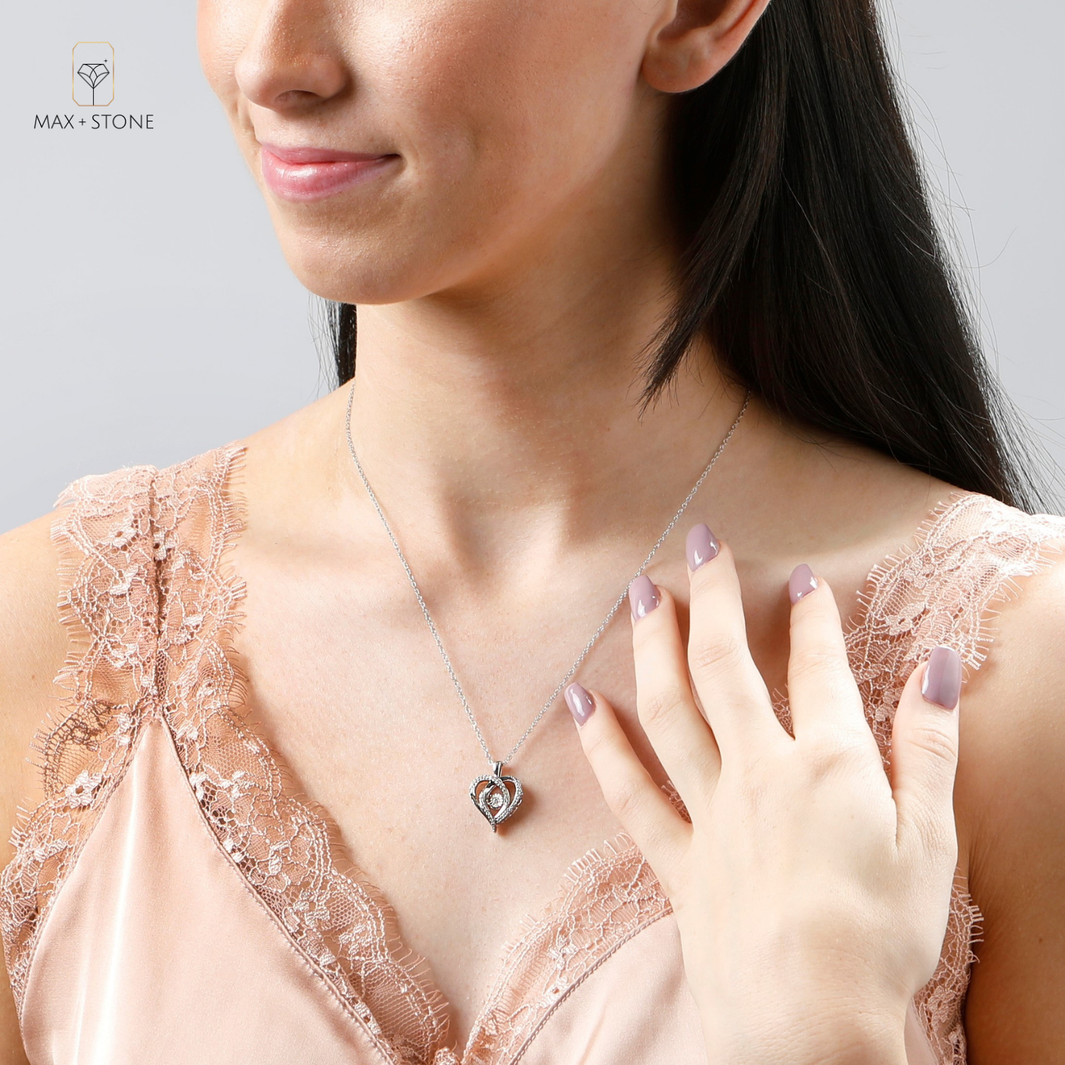 Dancing Diamond 'Miraculous Love' Real Diamond Heart Pendant Necklace in Sterling Silver (1/6 ct.tw), 18' Chain