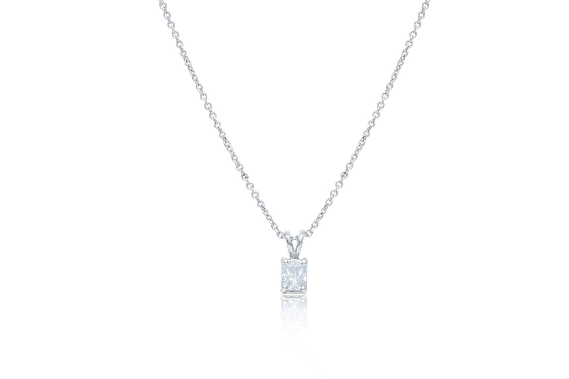 14kt white gold solitaire diamond pendant featuring 0.46 ct emerald cut diamond