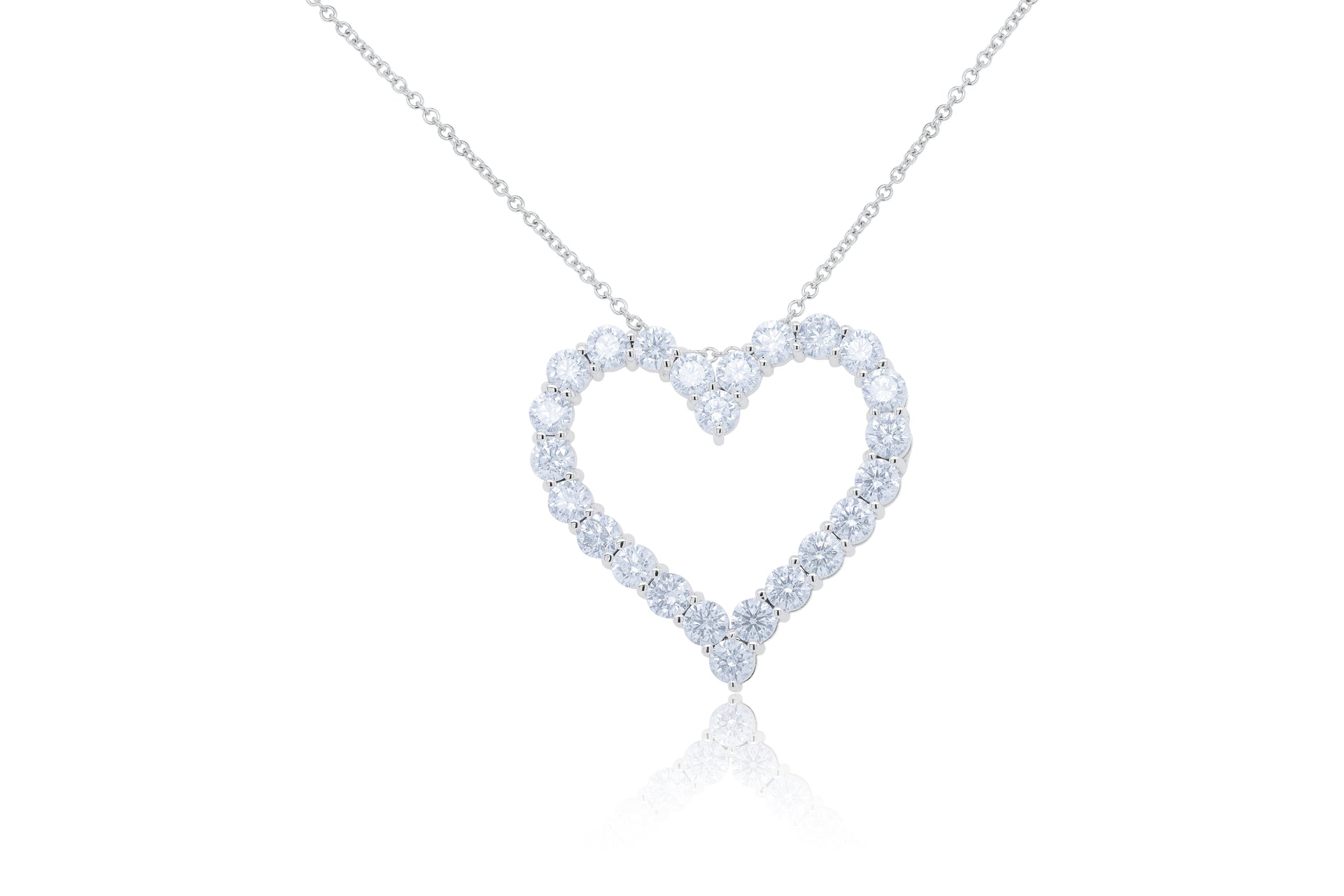 18kt white gold open heart pendant featuring 5.30 cts of round diamonds, 24 stones