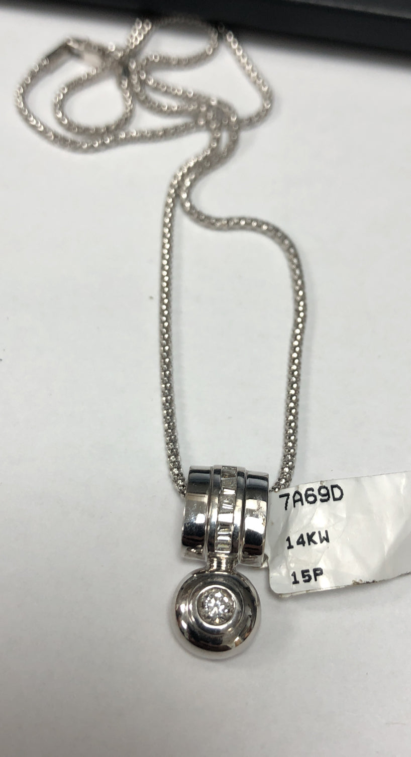 14kt white gold diamond pendant featuring 0.30 cts of round and baguette diamonds