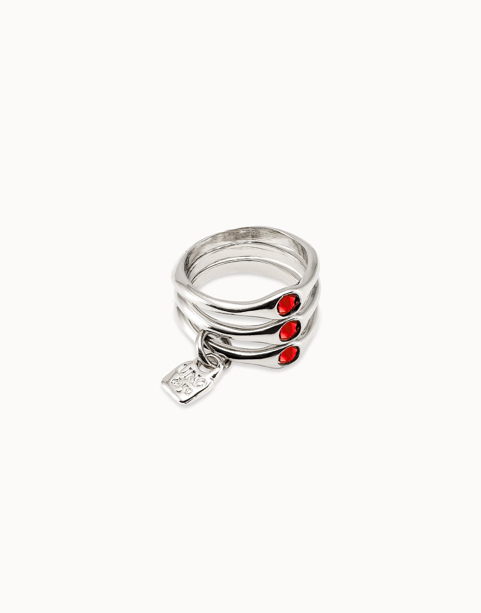 Triple ring with red crystals
