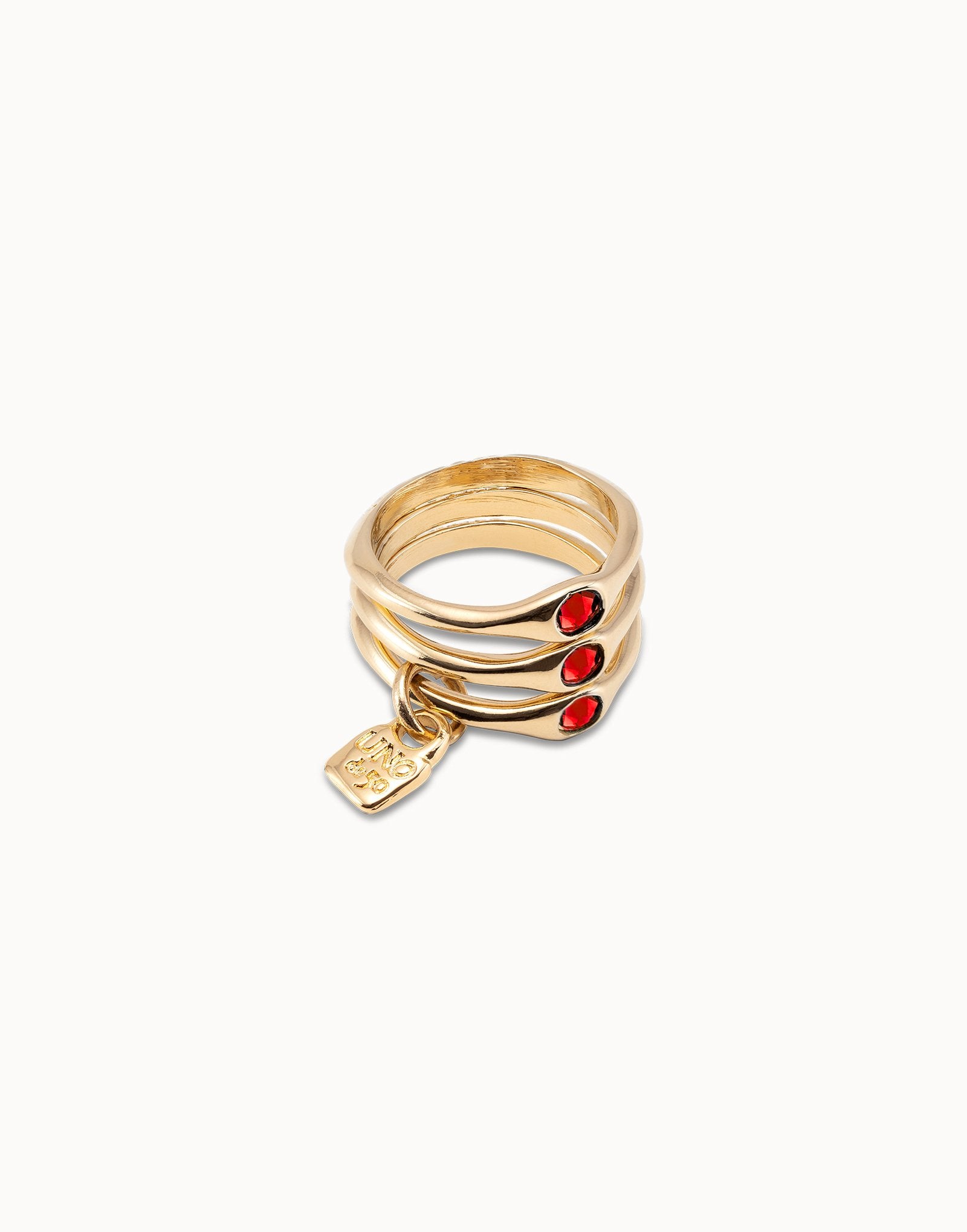 Triple ring with red crystals