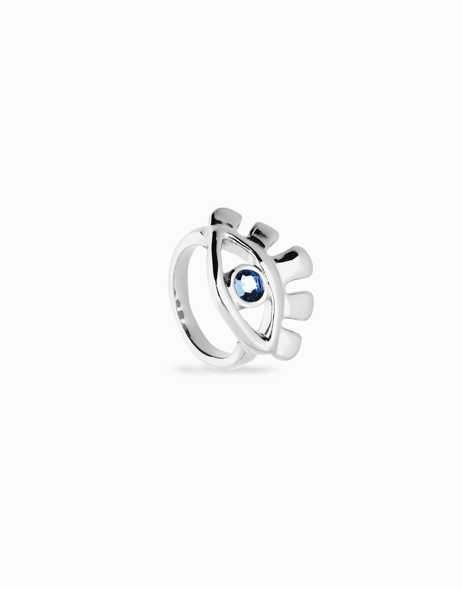 Eye-shaped ring with faceted blue crystal