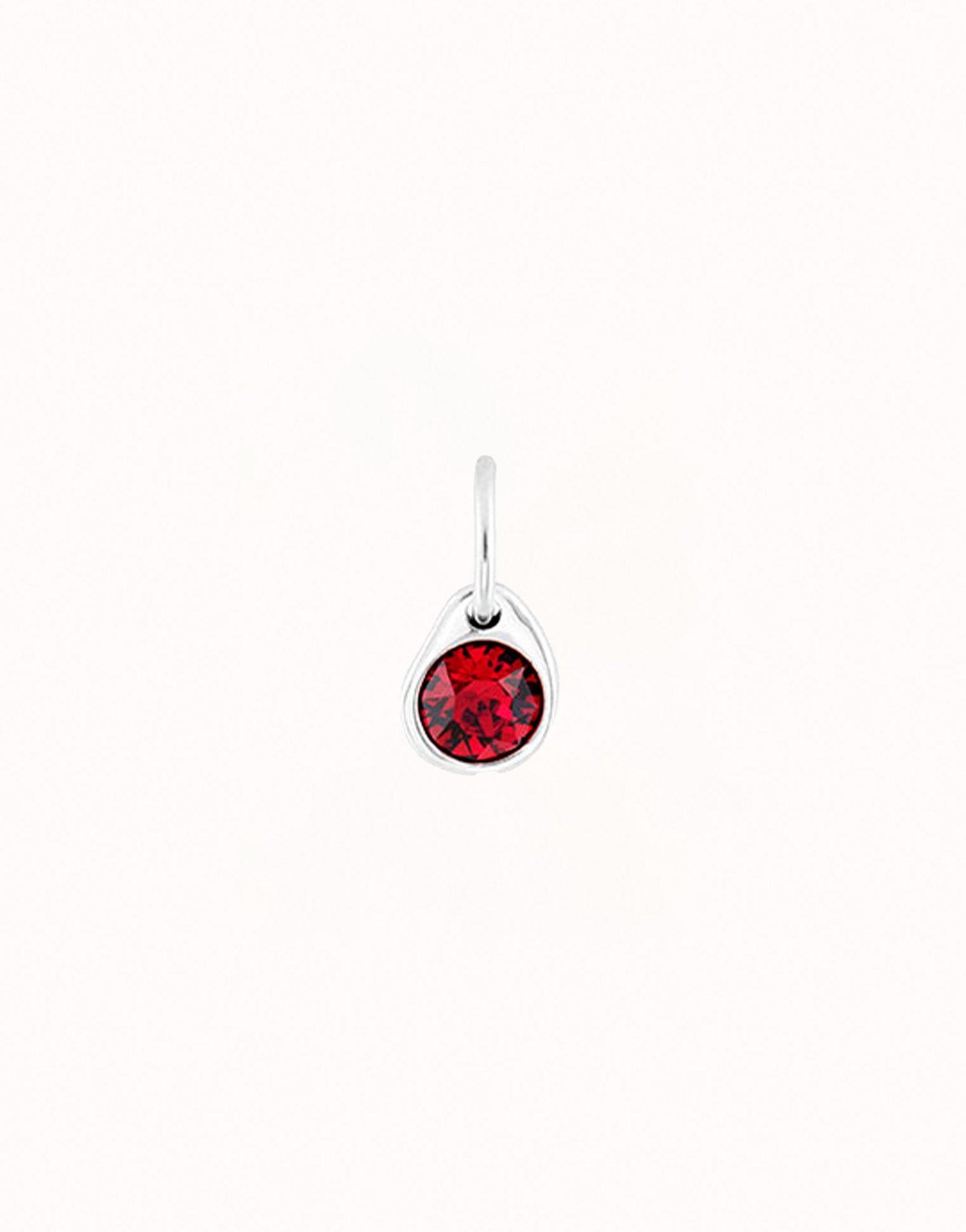 Charm with a red crystal