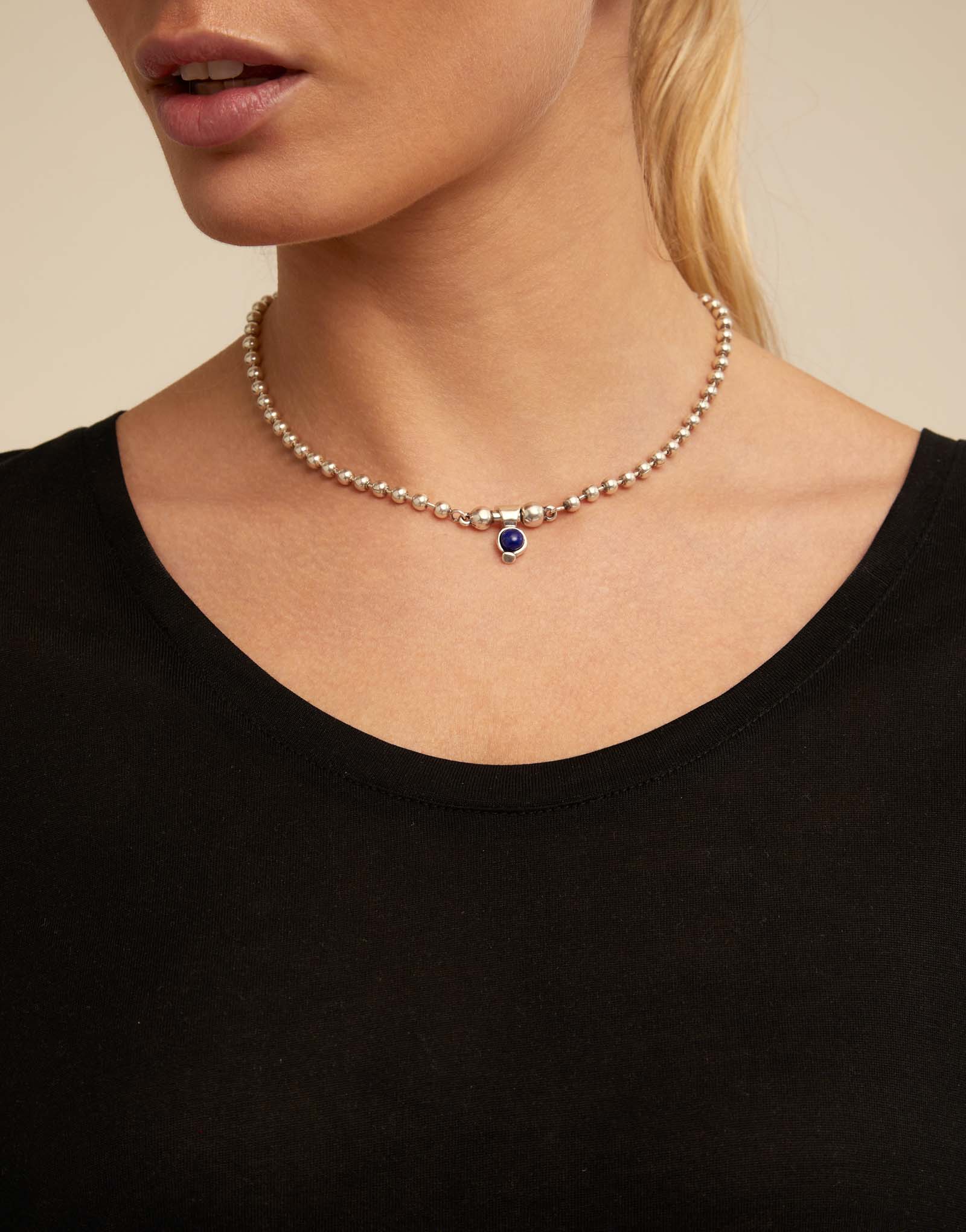 Charm with blue stone