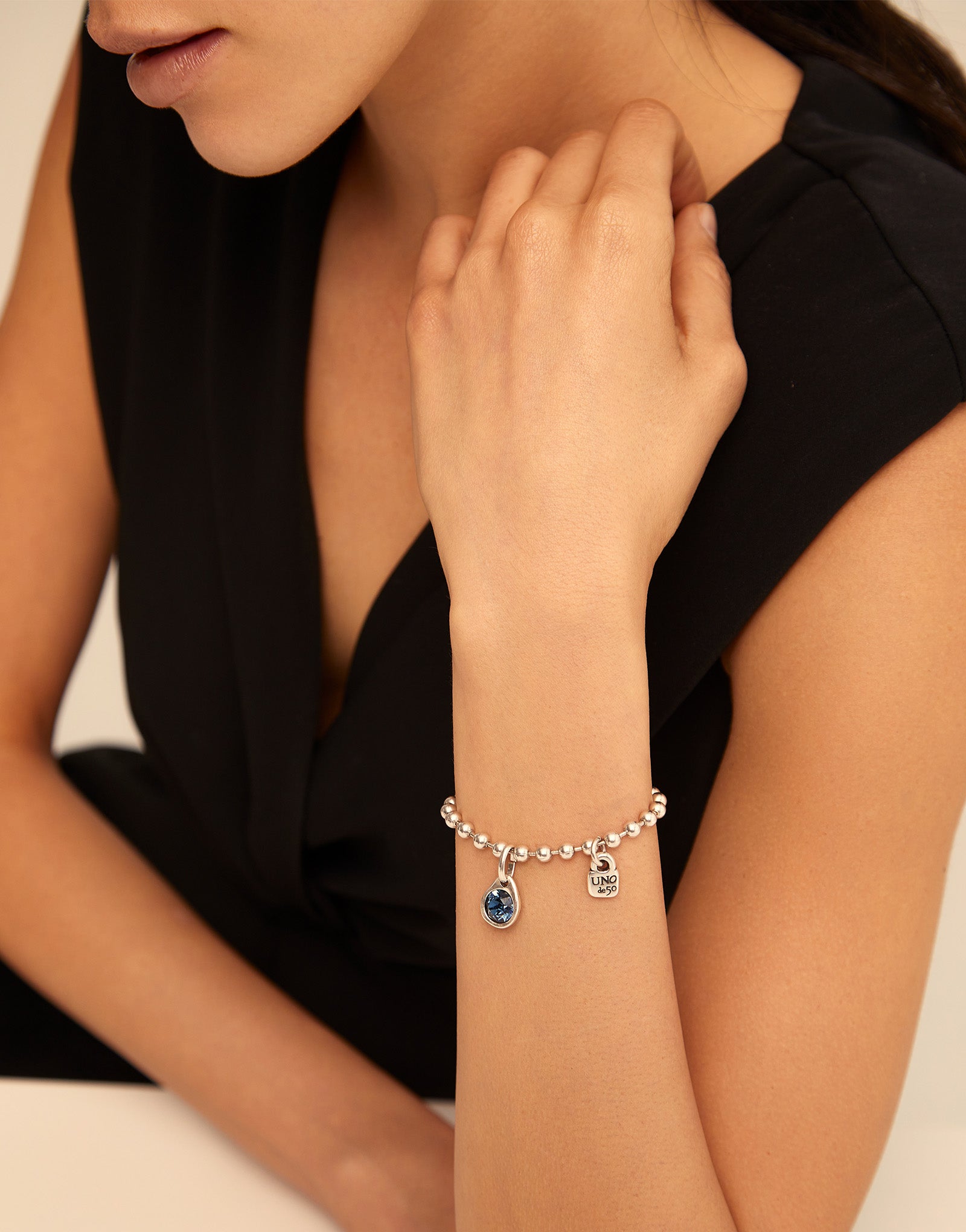 Circular charm with crystal