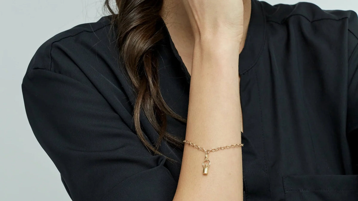 Weigh-Shaped Gold Charm bracelet