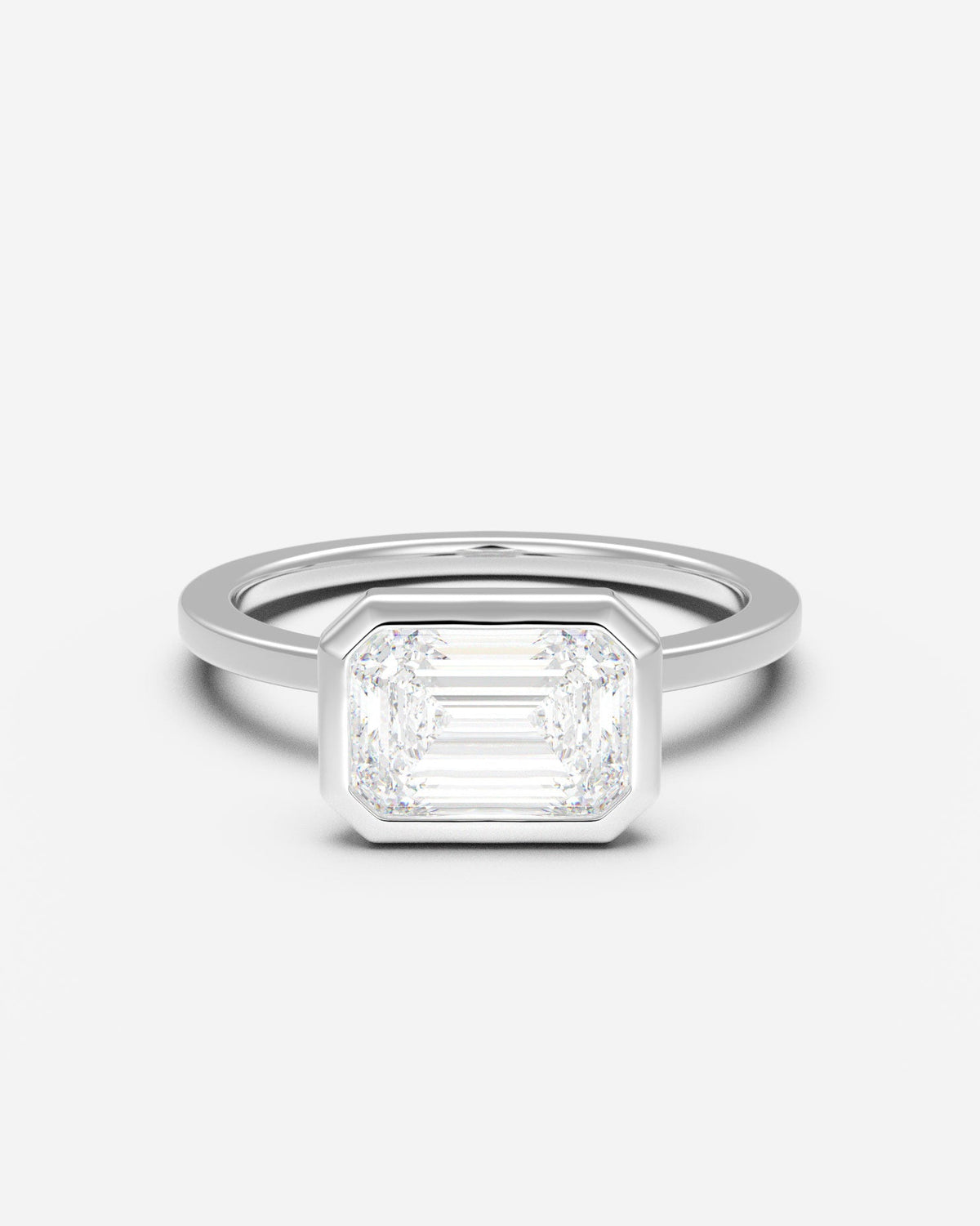 The East West Bezel Solitaire — Emerald