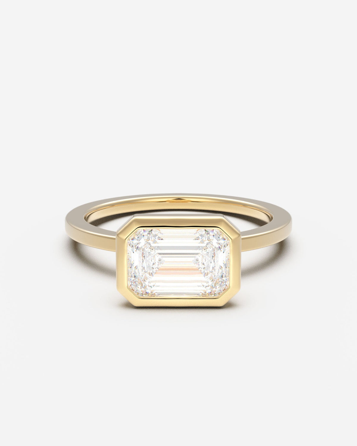 The East West Bezel Solitaire — Emerald