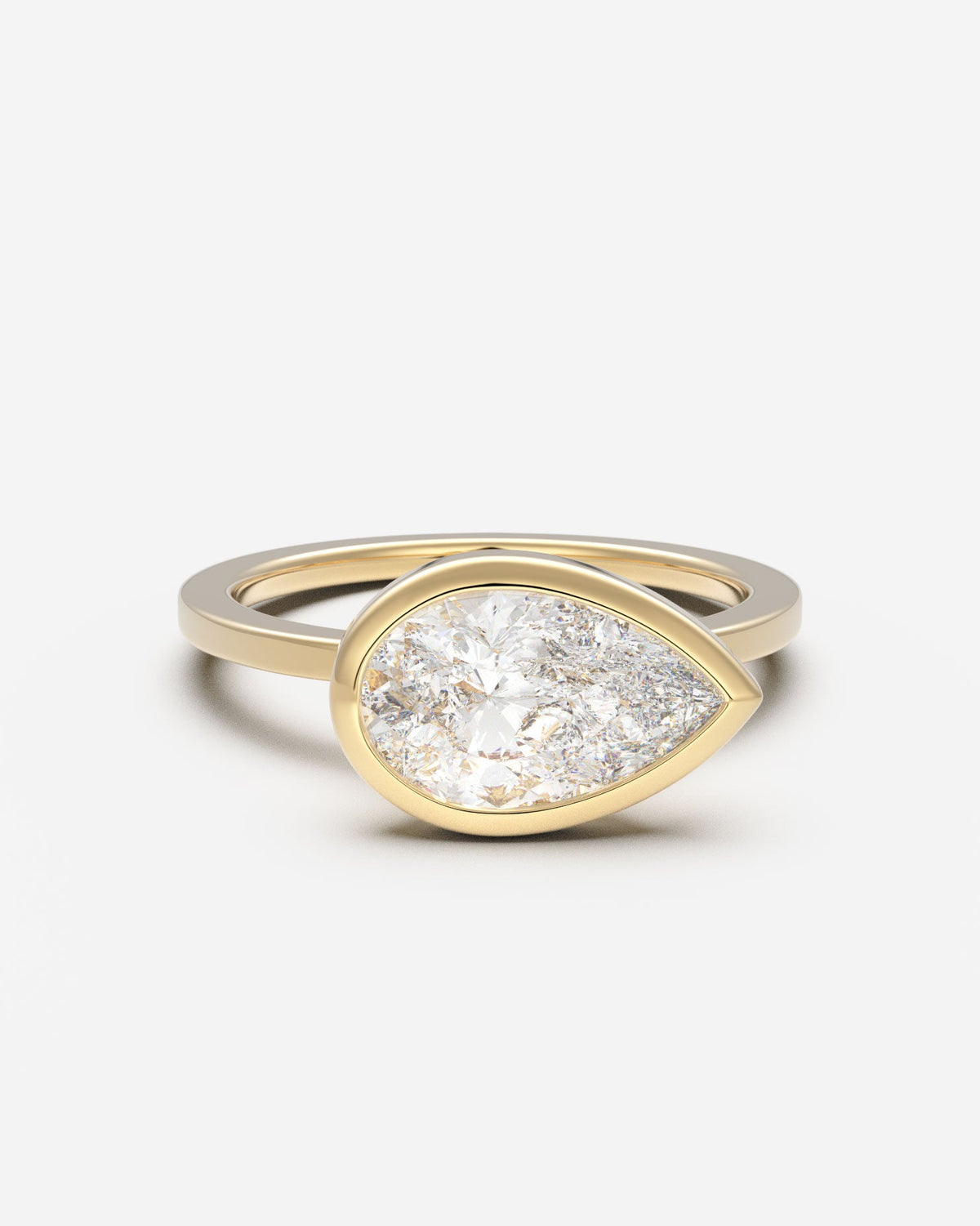 The East West Bezel Solitaire — Pear