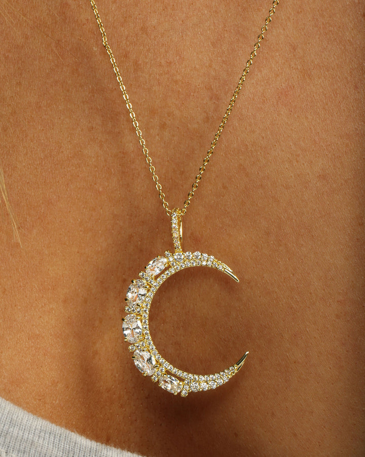 she-is-an-icon-moon-necklace-in-gold-and-white-diamondettes