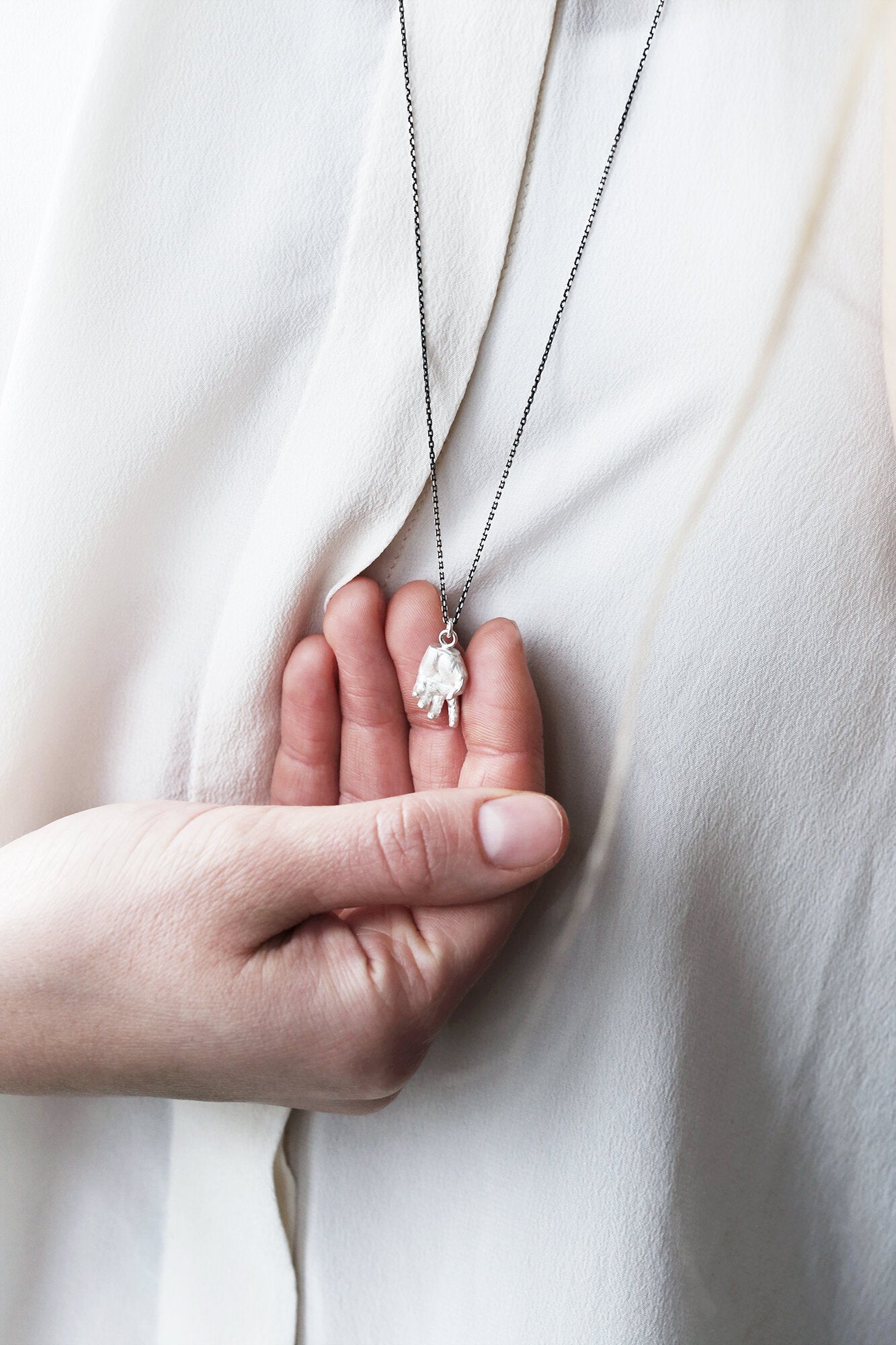 strong-by-herself-silver-hand-pendant