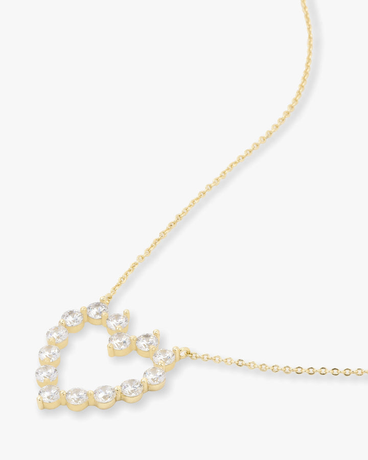 she-is-an-icon-baby-heart-necklace-in-gold-and-white-diamondettes