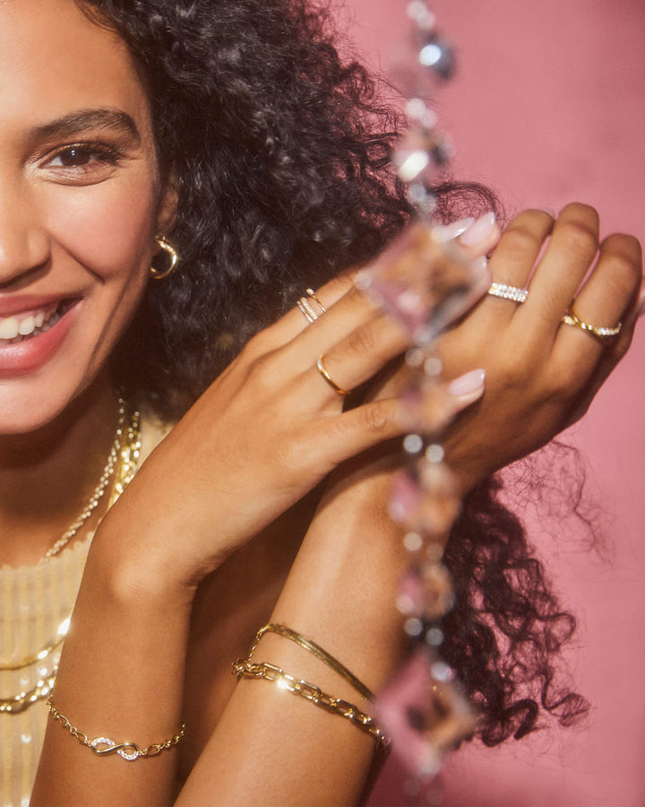 annie-gold-infinity-ring-in-white-crystal-swarovski