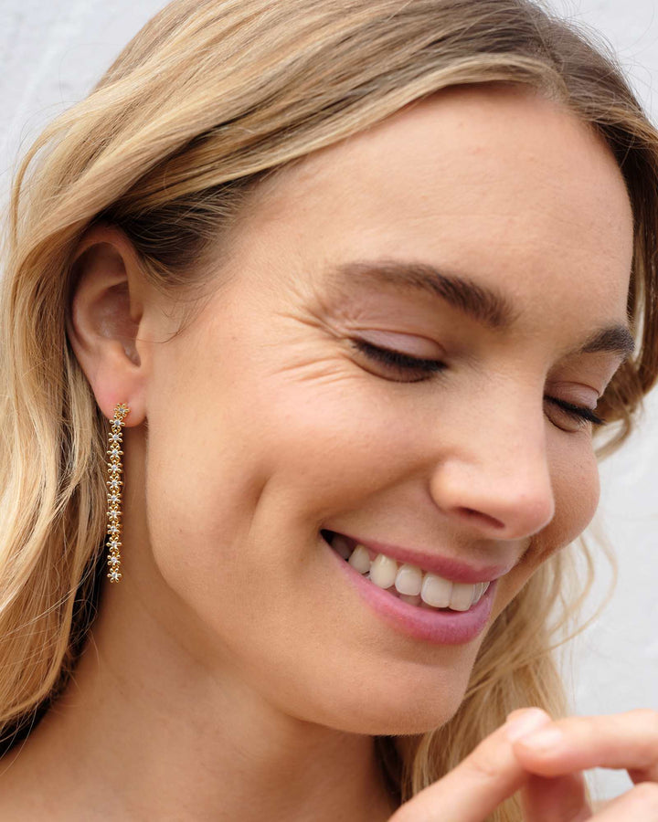 nydia-gold-linear-earrings-in-white-swarovski