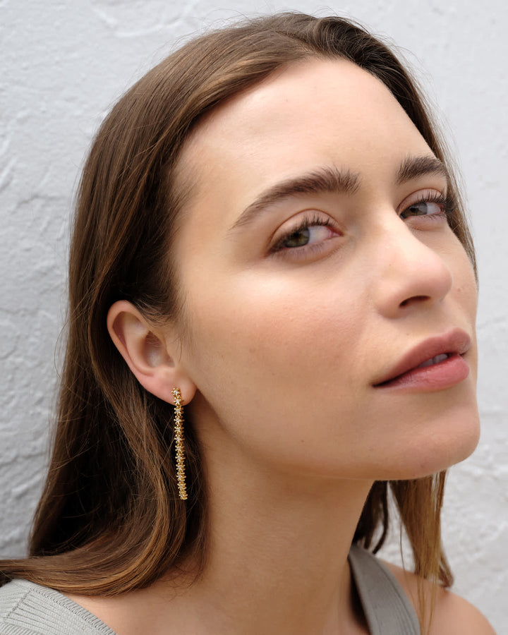 nydia-gold-linear-earrings-in-white-swarovski