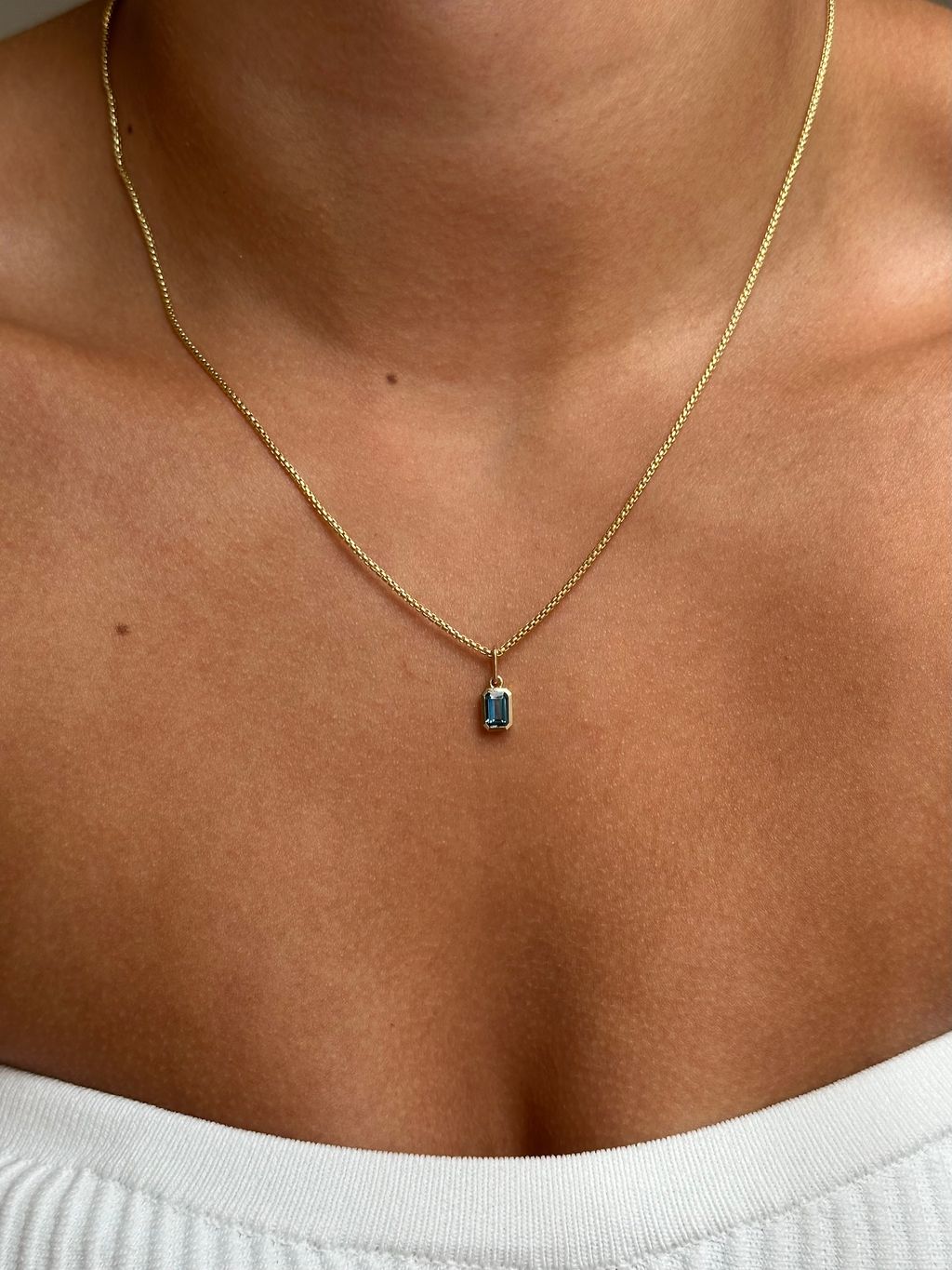 Gold Emerald Shaped London Blue Topaz Charm