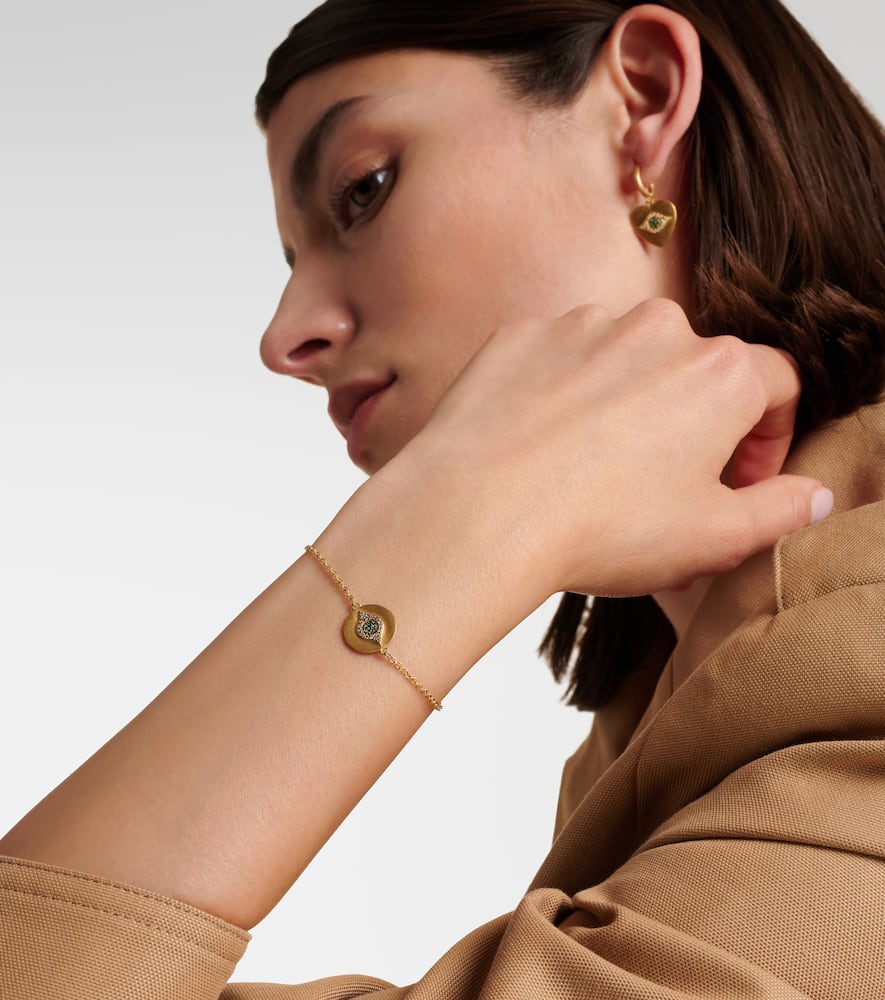 Eye 18kt gold bracelet with diamonds, tsavorites, and sapphires