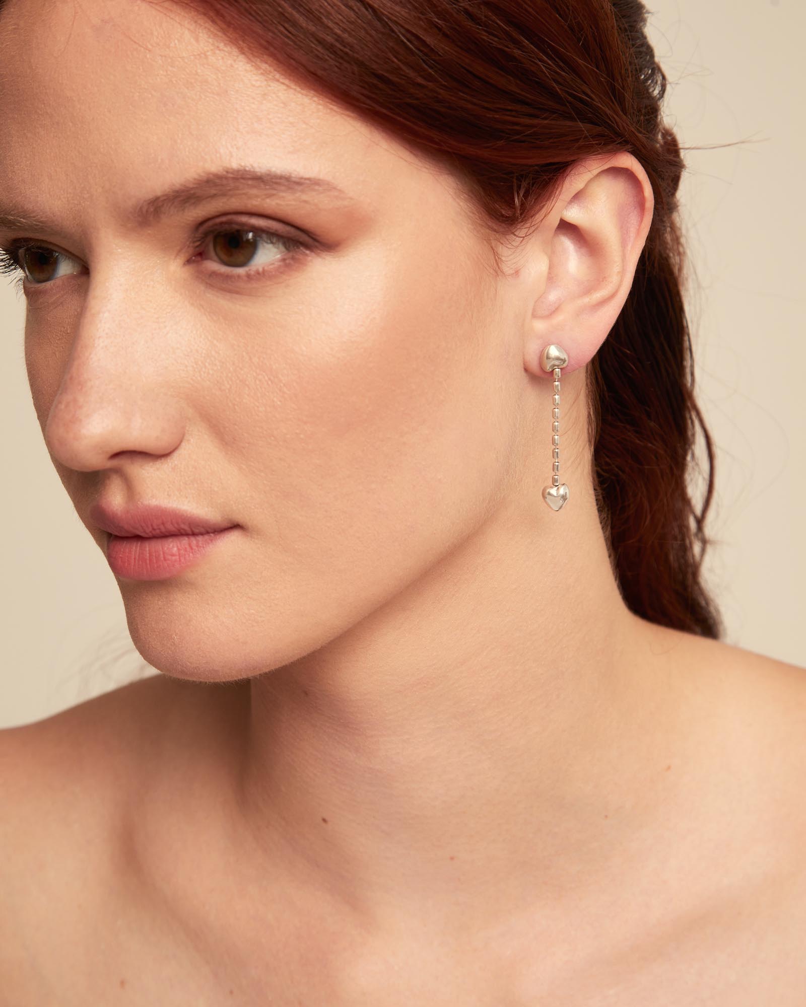 Drop earrings with small hearts