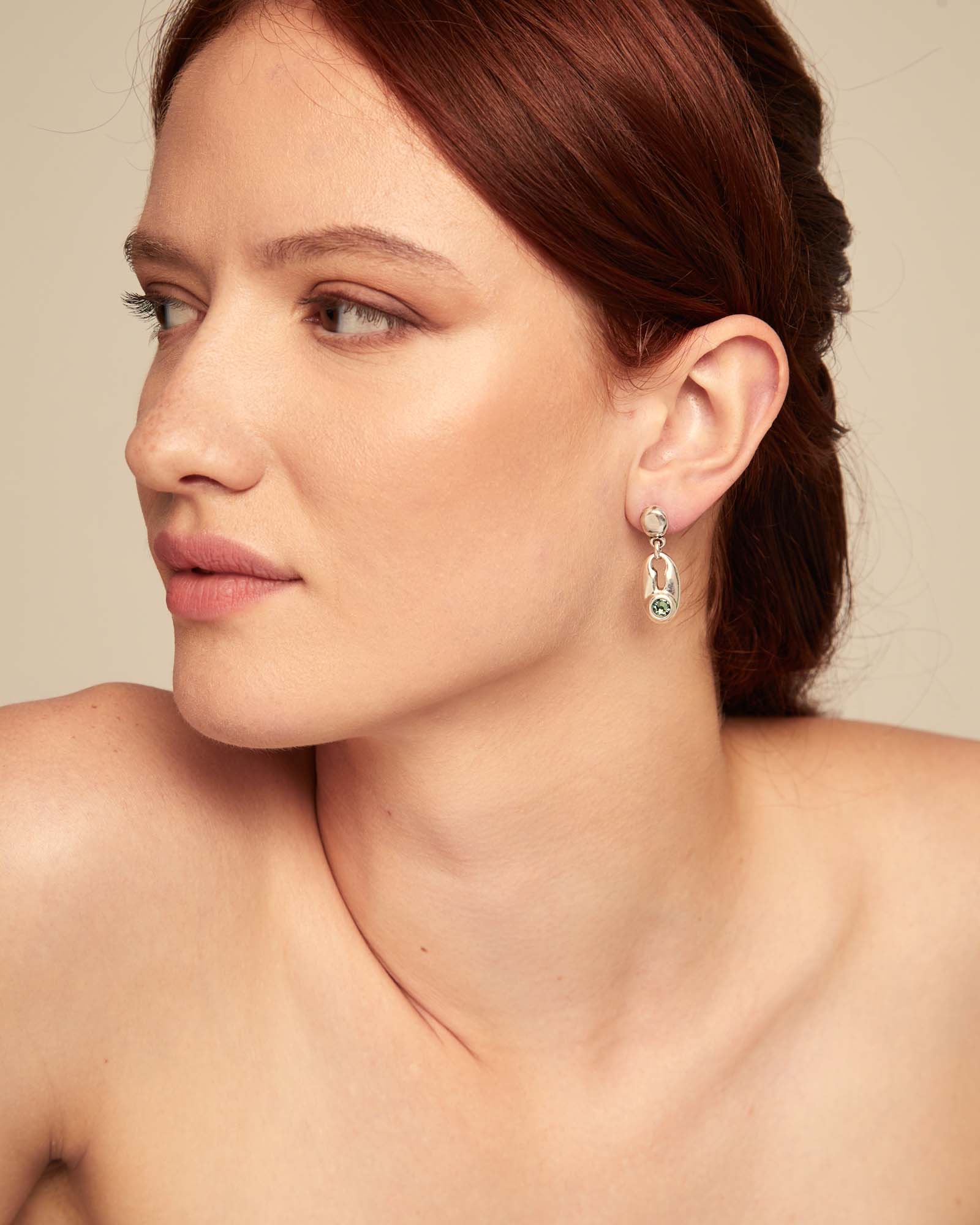 Drop earrings with green crystal