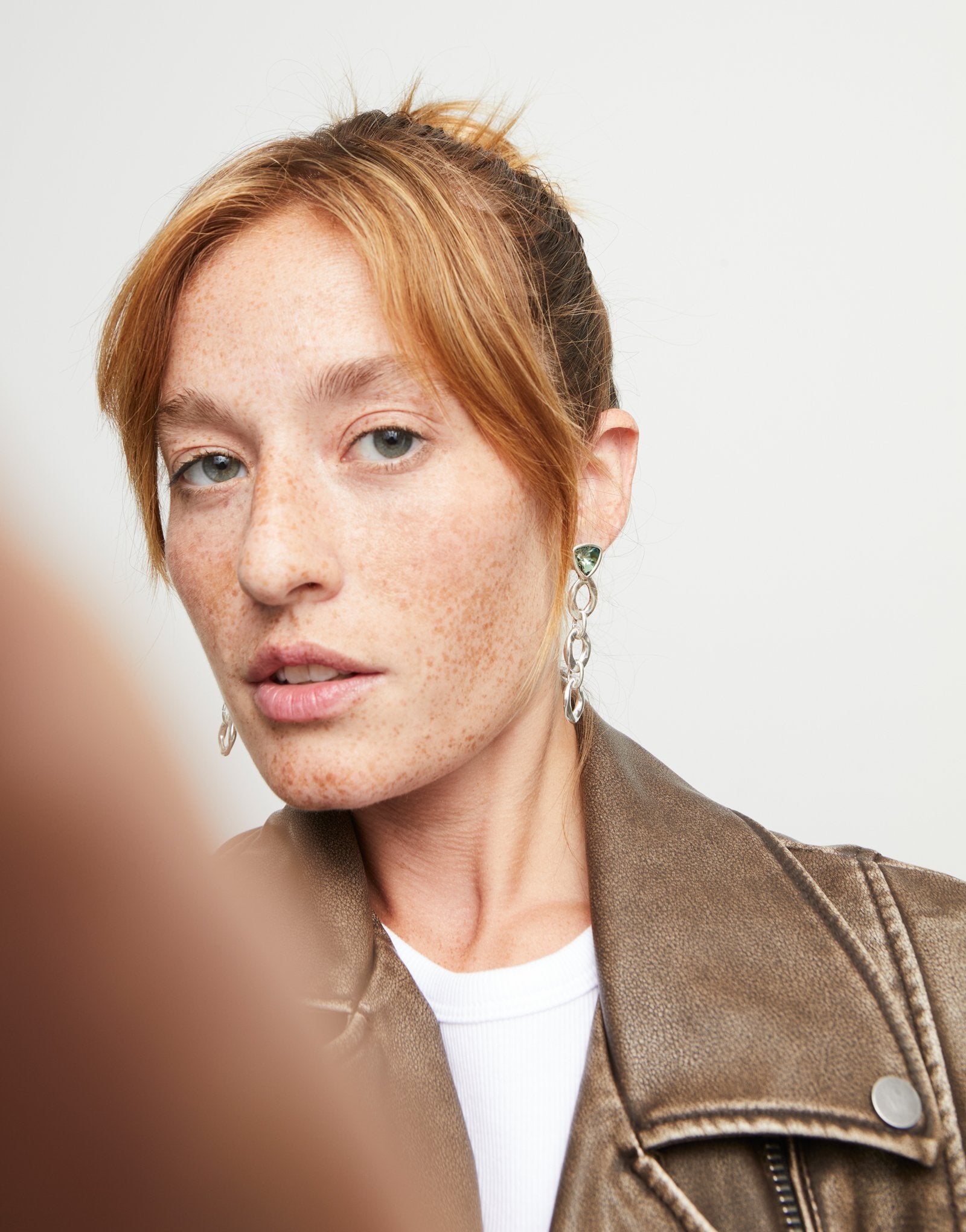 Drop earrings with green crystal