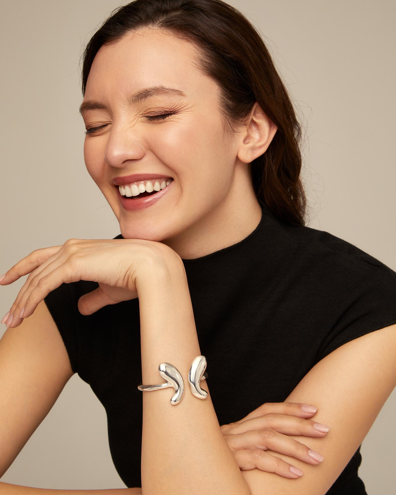 Bangle bracelet  with a central butterfly