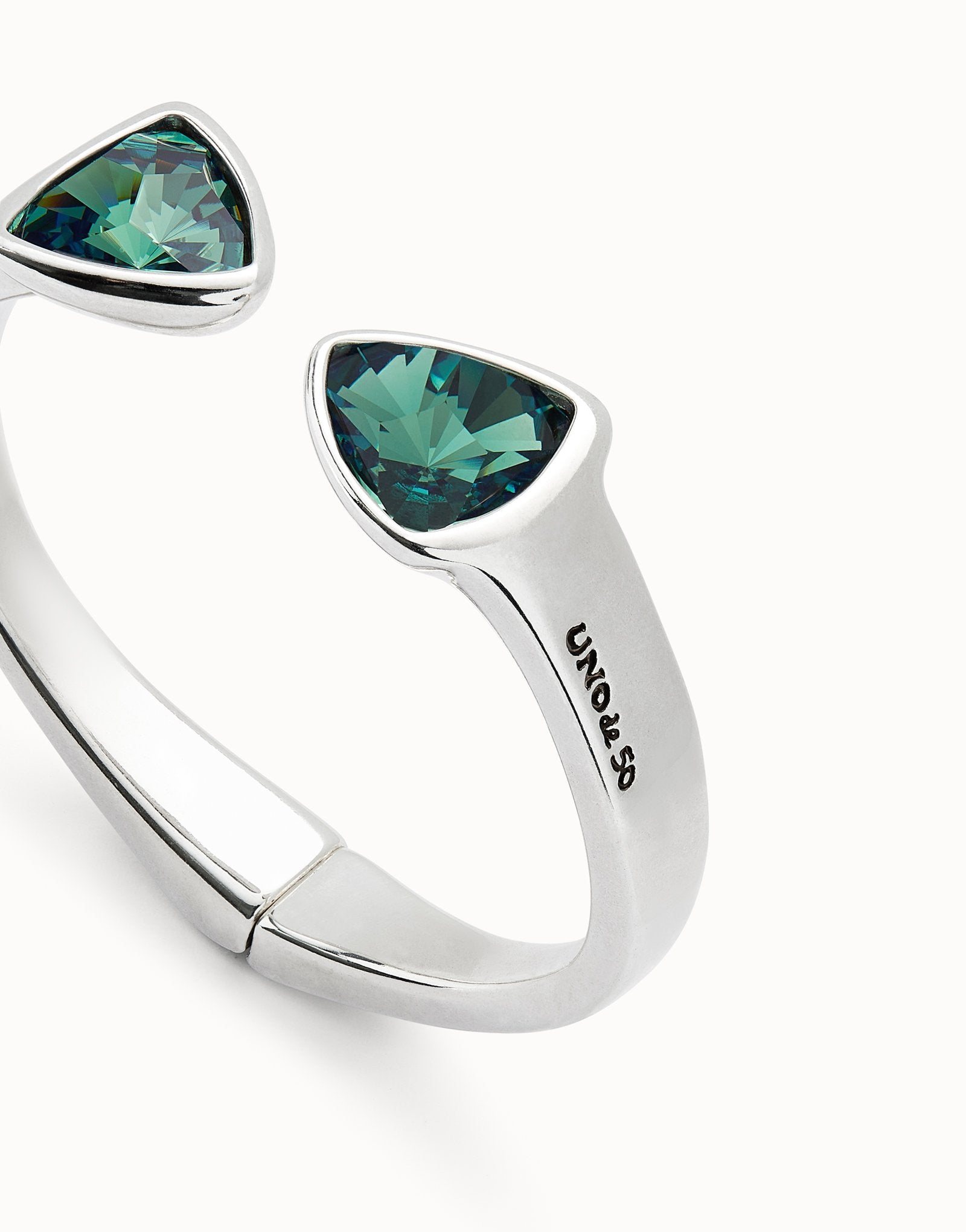 Bangle bracelet with two green crystals