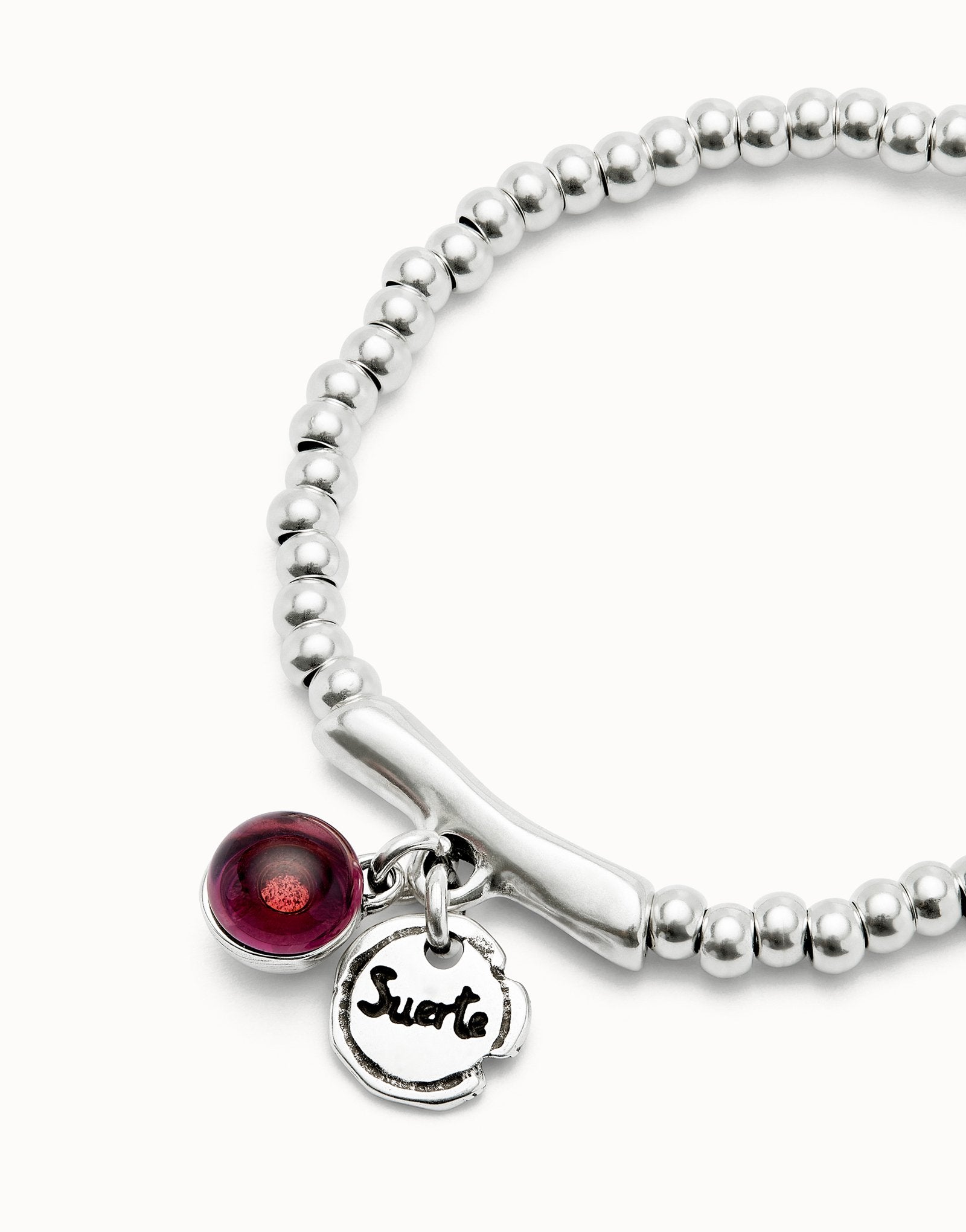 Beaded stretch bracelet with a murano glass and the word lucky