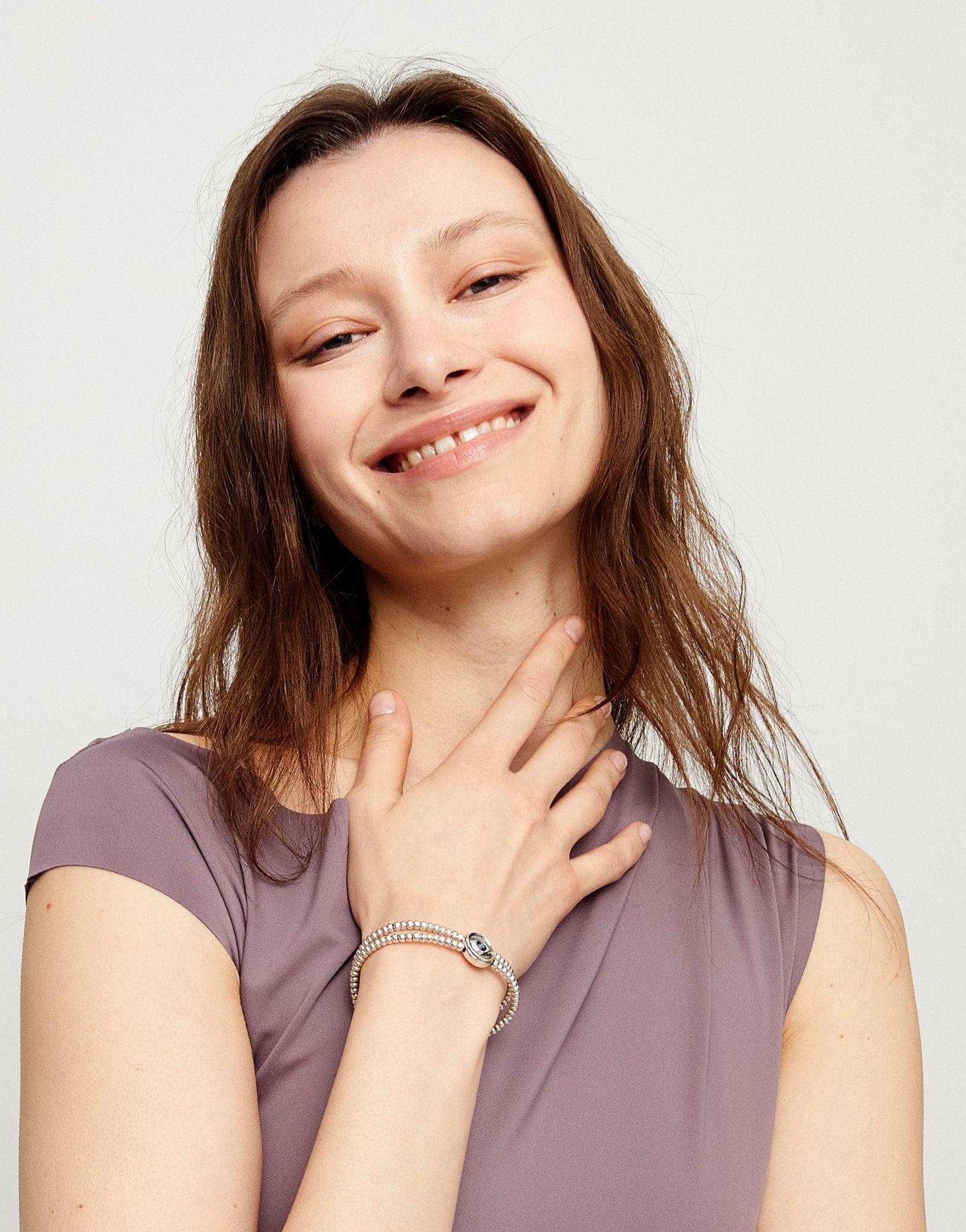 Two-strand beaded bracelet with an eye-shaped charm