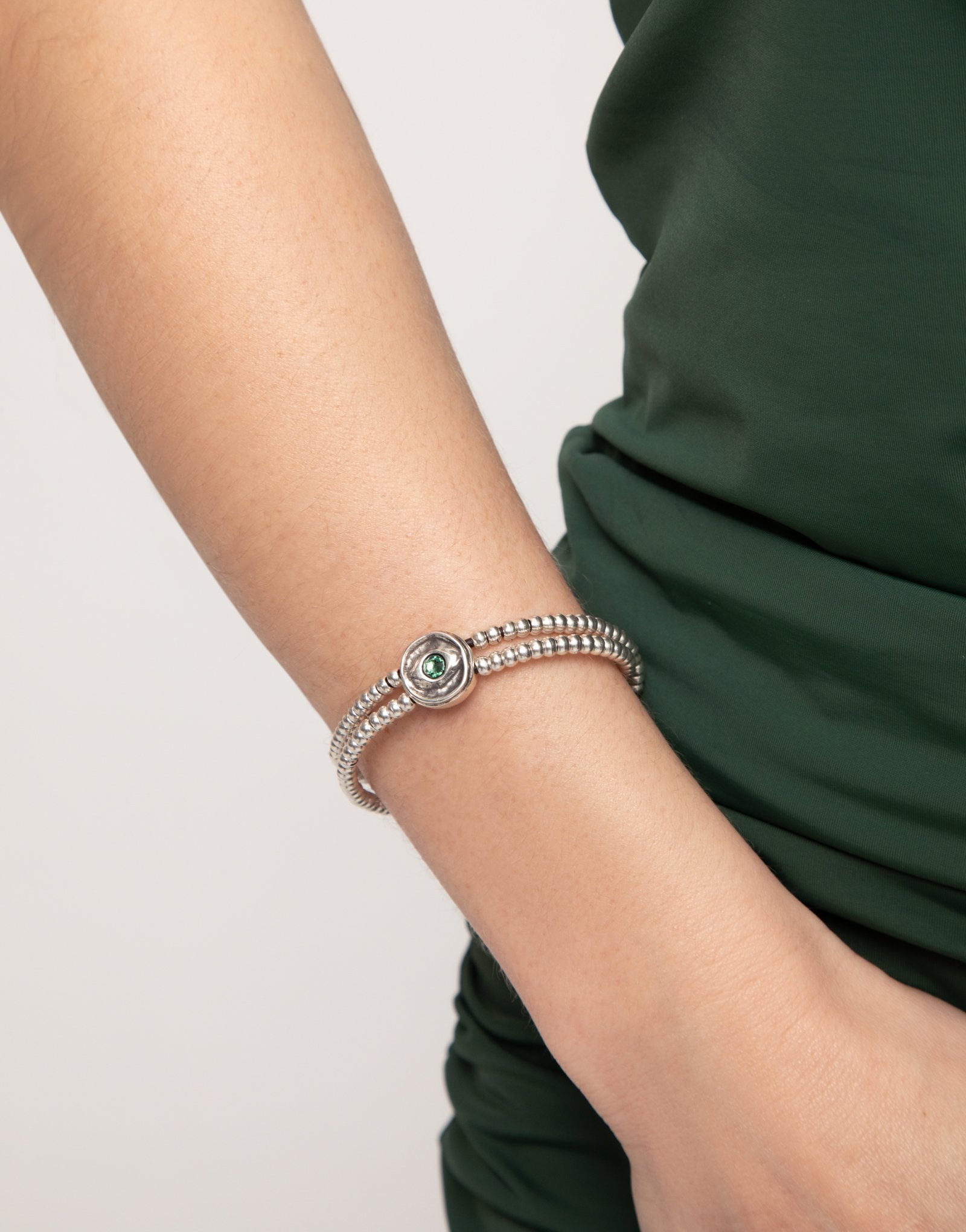 Two-strand beaded bracelet with an eye-shaped charm