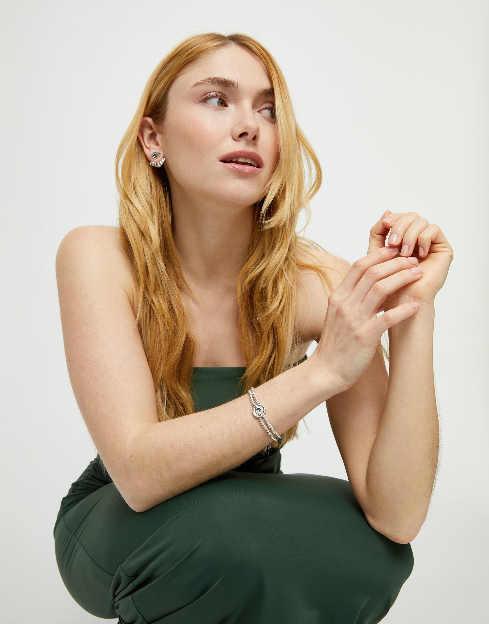 Two-strand beaded bracelet with an eye-shaped charm