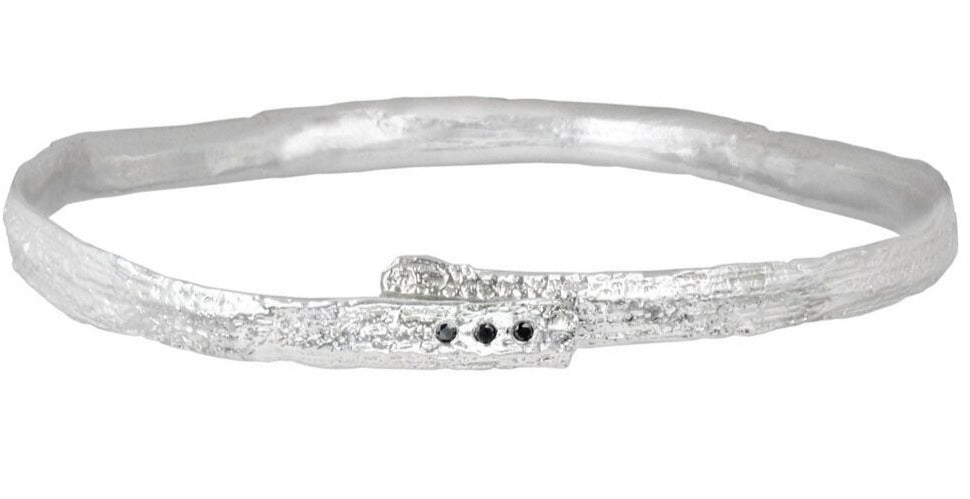 the rattan bangle with three black diamonds